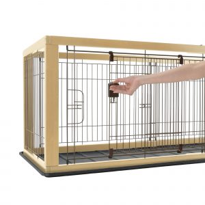 person demonstrates sliding door on expandable pet crate