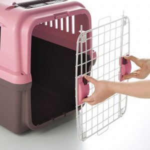 person demonstrates how to fasten front gate to pet carrier