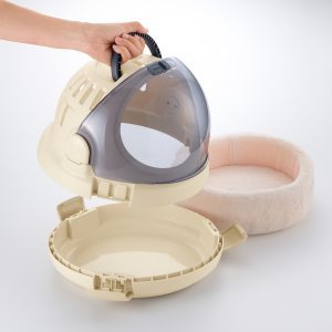 Demonstrating assembly of pet carrier and bed