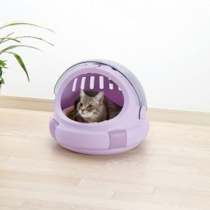 Cute gray cat lounges in hooded cat bed