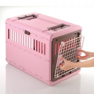 attached door to pink pet carrier