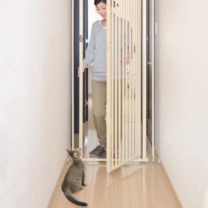 Lady and Cat by Safety Gate